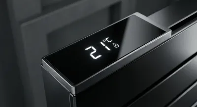 Gros plan sur l'écran digital d'un thermostat de radiateur Equation affichant la température.